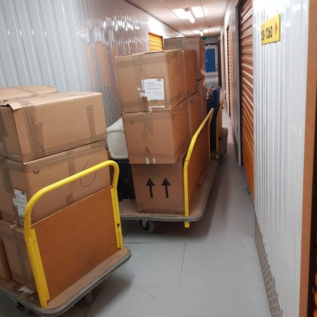 this is a pic of packed luggage in the trolley outside the storage unit